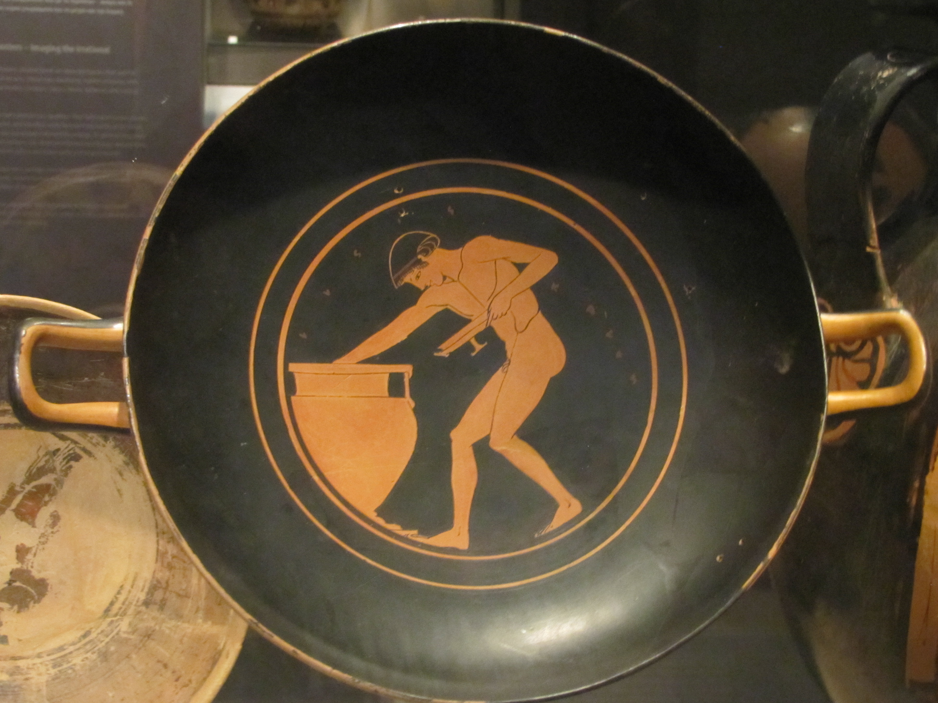 red figure kylix youth with kylix beside krater